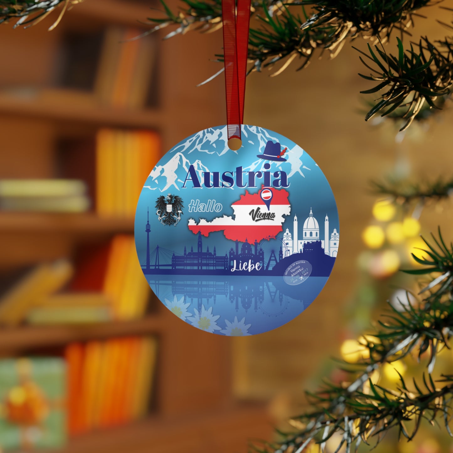 Decorative ornament with Austria-themed design hanging on a Christmas tree.