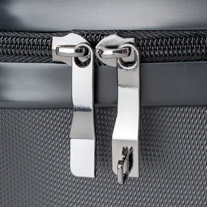 detail view stainless steel zipper tabs on suitcase