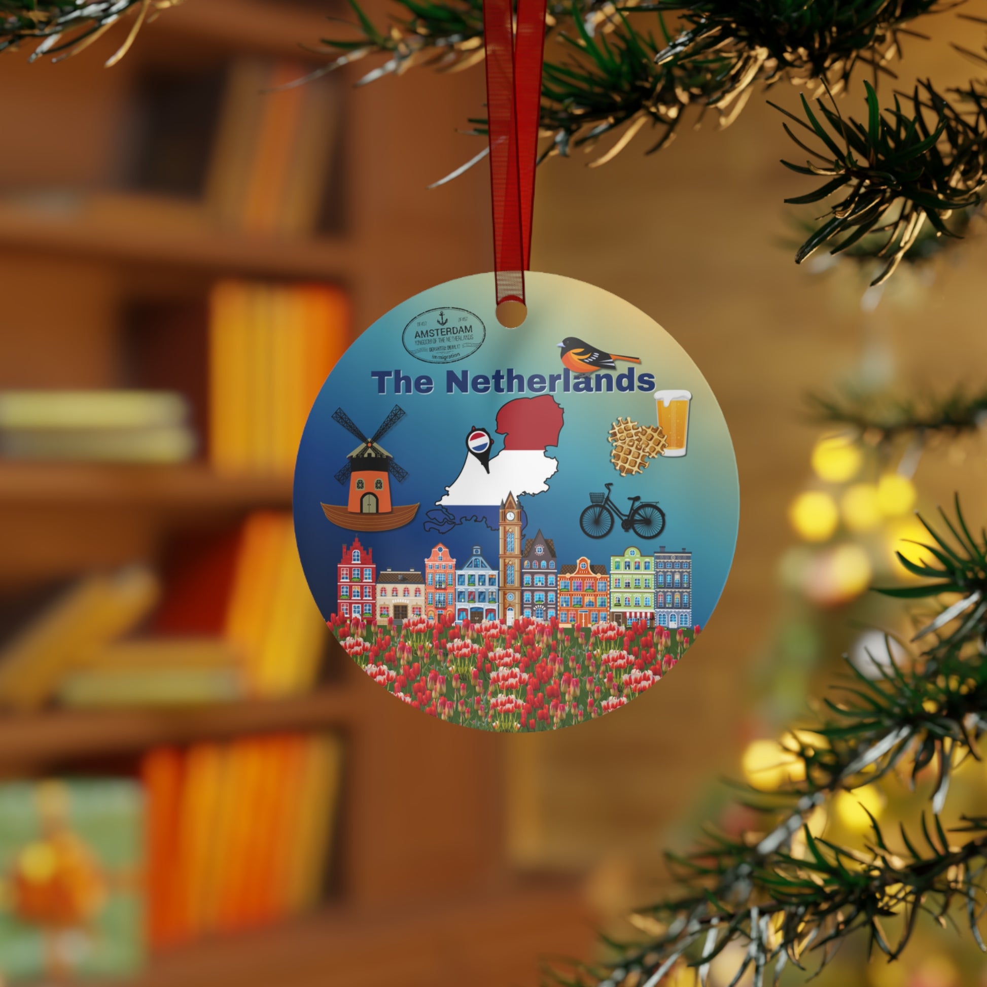 Decorative ornament with 'The Netherlands' theme hanging on a Christmas tree.