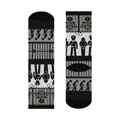 A pair of crew socks with a mid-calf height featuring a black and white pattern with law enforcement and legal-themed graphics.