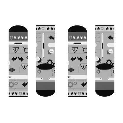A pair of gray socks with a design of stars, gears, and other graphic elements related to user experience (UX) design.